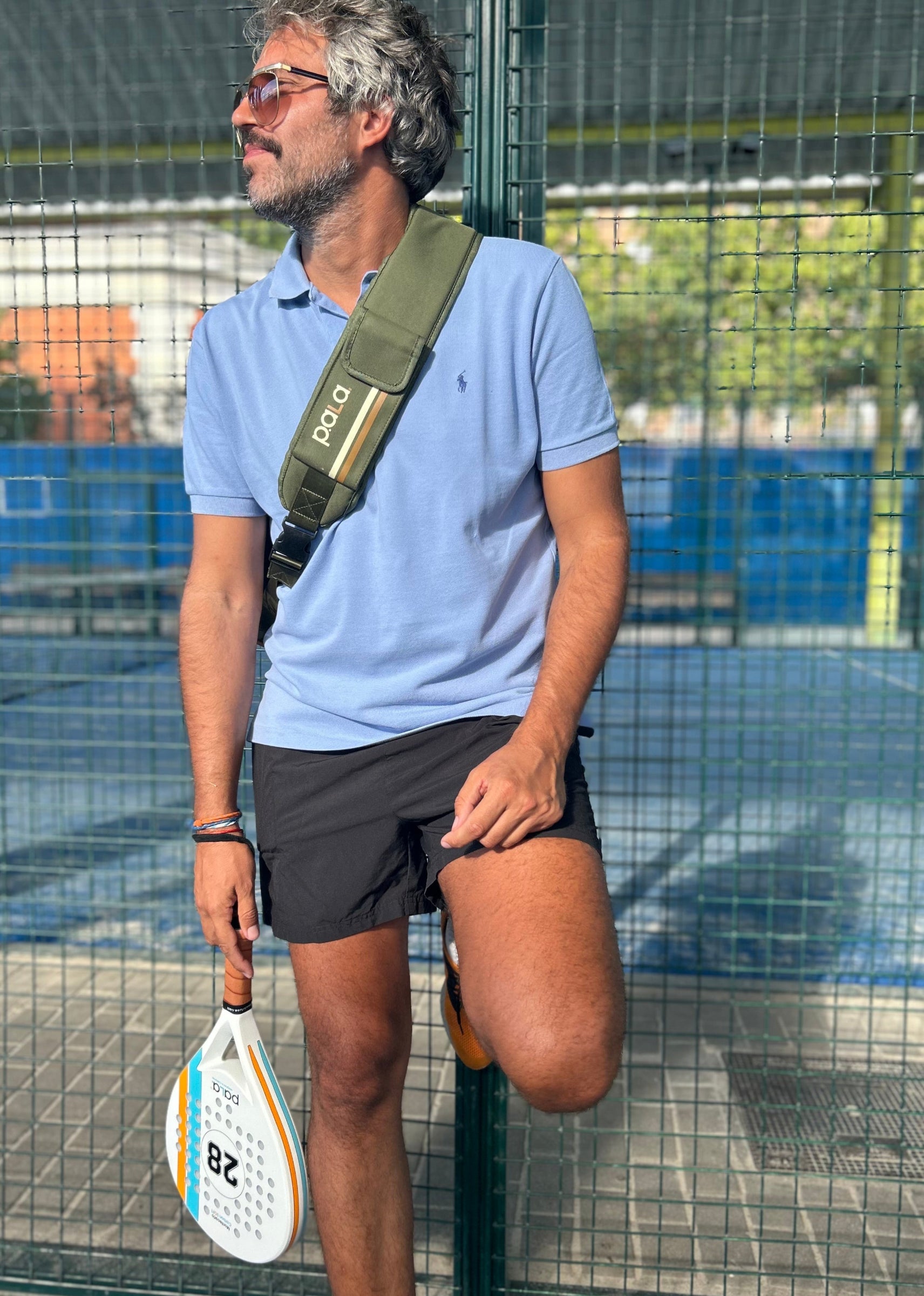 men playing padel in a padel court with a white montecarlo padel racket by p.ala padel usa