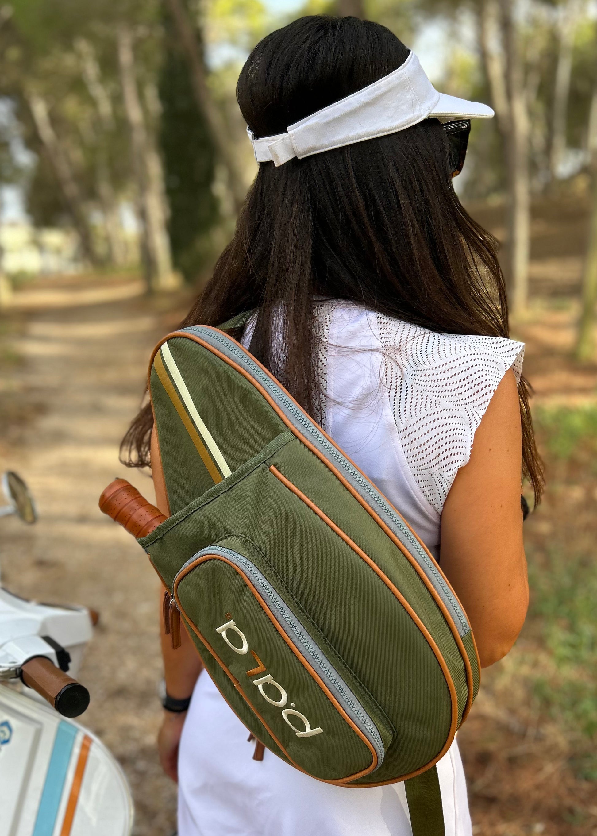 women with green padel bag