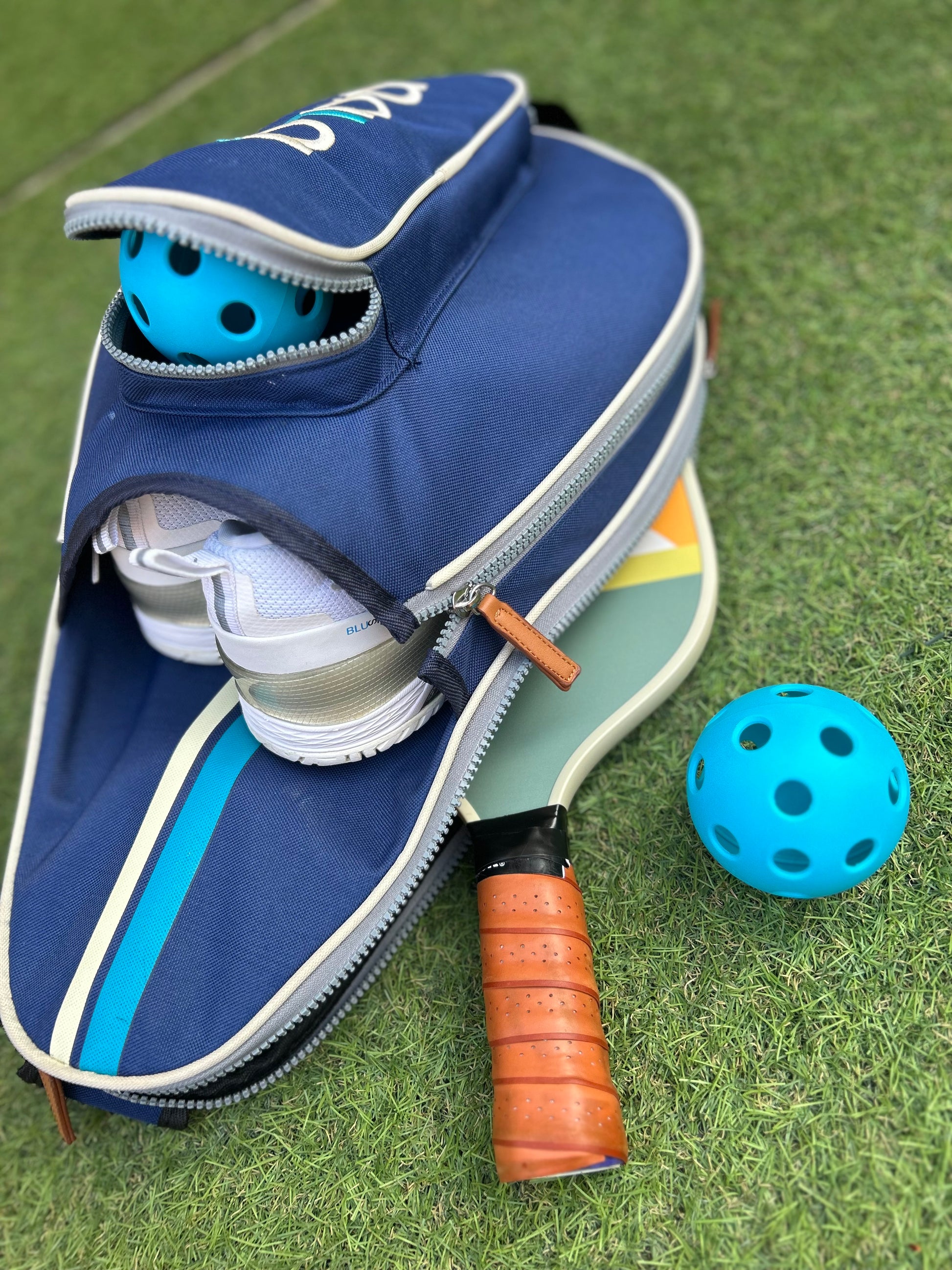 Modern blue pickleball bag with space for rackets and accesories